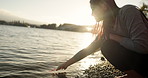 Japanese woman, red maple leaf and Lake Kawaguchi with game, thinking or memory in nature, adventure or holiday. Girl, plant and sunrise for vacation by forest, environment or waves by water in Tokyo