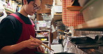 Japanese chef man, cooking and chopsticks by stove, service or catering job on heat, flame or ready. Person, restaurant or cafeteria in kitchen for meal prep, working or thinking for recipe in Tokyo