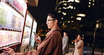 Vending machine, man and phone payment at night, automatic digital purchase or choice in city outdoor. Smartphone, shopping dispenser and Japanese business person on mobile technology in urban Tokyo