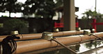 Shinto temple, closeup and fountain with water in container for faith, clean or washing hands for wellness. Religion, mindfulness or praise with purification ritual in woods, peace or shrine in Kyoto