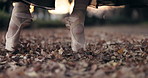 Feet, ballet and outdoor pointe or closeup of creative performance in Japanese garden, leaves or elegant. Toes, shoes and dancing movement in forest or spin in nature for entertainment, art or music