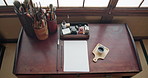 Art, paper and calligraphy tools from above with creative brushes, pencil and ink for illustration. Japanese sumi, document and home isolated with drawing, creation and creativity for painting