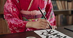 Japanese woman, art and calligraphy for drawing, creativity or sketching with thinking, ideas and home. Girl, person or artist with brush, vision and paper in traditional clothes for culture in Tokyo