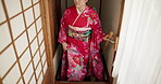 Japanese woman, stairs and house in traditional clothes in hall, mindfulness and reflection in religion. Asian person, happy and walking by home staircase in peace, culture and spiritual development