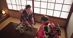 Japanese women, culture and tea ceremony for friends with respect, kindness and relax with bow at table. Girl, people and together for drink, matcha or indigenous clothes with cup, meeting and above