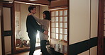 Mature couple, dancing and happy or love in home, communication and security or connection. Asian people, smiling together and celebration of anniversary, support and embrace or trust in marriage