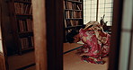 Japanese woman, praying and shinto faith with meditation, religion and traditional clothes on floor. Girl, person and prayer with mindfulness, zen and balance with peace, calm and studying in Tokyo