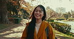 Japanese, face and woman with smile in park for travel on vacation, adventure and explore path with trees. Gen z, girl and happy portrait of walk on holiday in nature with forest and river in Kyoto