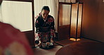 Traditional, tea and woman in Japanese ceremony, service and tray with matcha or ginseng. Asian, culture and calm master in kimono with respect for hospitality, indigenous heritage and beverage