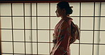Culture, home and traditional Japanese woman in indigenous clothing, style and kimono. Corridor, fashion and person walking in house for morning routine, relax and ritual, wellness or ceremony