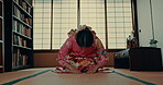 Woman, Japanese and traditional prayer for spiritual practice in tatami room for religious healing, wellness or gratitude. Female person, kimono dress and koto dama worship, holy life help or respect
