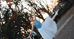 Sunset, dancing and ballet woman in a park practicing for a concert, show or classical theater. Art, elegant and Japanese female ballerina in rehearsal with music at outdoor garden or field in Autumn