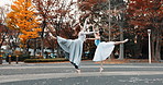 Nature, dance and ballet women in a garden practicing for a concert, show or classical theater. Art, elegant and Japanese female ballerinas in rehearsal with music at outdoor park or field in Autumn.