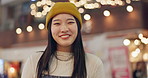 Japanese woman, face and happiness in town for travel, wellness and leisure on weekend vacation. Young person, smile and portrait in tokyo city on holiday, positive attitude and relax by bokeh lights