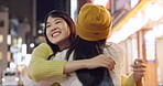 Japanese women, hug or happy in city for travel, bonding or care on weekend vacation in street. Friends, smile or embrace in tokyo town on holiday, wellness or unity together for social in solidarity