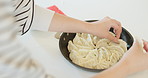 Dumpling, Japan food and hands of person in kitchen for eating, meal preparation and cuisine. Home, cooking and closeup of Japanese dish for lunch, dinner and supper for wellness, diet and nutrition