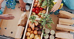 Hands, groceries and food drive with people packing box from above for charity or community service. Donation, mindfulness and poverty with volunteer team collecting essential supplies closeup