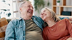 Happy, hug and senior couple hug on a sofa with funny, conversation and bonding at home together. Marriage, support and old people embrace in a living room with trust, love or gratitude, joke or care