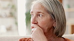 Anxiety, thinking and senior woman in a house with stress, fear or worry, Alzheimer or memory trauma. Depression, mental health or elderly female person with dementia, disaster or overthinking crisis