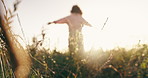 Freedom, dance and woman on a field at sunset for fun, celebration or adventure in nature with lens flare. Energy, travel and female person in countryside moving outdoor with gratitude for sunshine