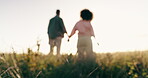 Blur, countryside and couple holding hands, love and sunshine with weekend break, romance and unity. Walking, man and woman in a field, nature and getaway trip with anniversary and bonding together