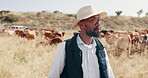 Walking, cattle and black man in farm thinking of sustainability or agriculture in African countryside. Nature, land and cow farmer with small business ideas for dairy, animals or food production