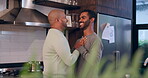 Gay, couple and smile or dancing in home with bonding, entertainment and romance in kitchen of house. Lgbtq, confidence or men with music, freedom and movement for celebration, happiness and love