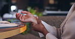 Cafe, closeup and business with woman, wrist pain and inflammation with injury, overworked and employee. Hands, worker and professional in a restaurant, carpal tunnel syndrome and burnout with stress