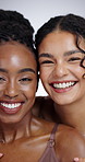 Face, beauty and smile of woman friends in studio on gray background together for natural wellness. Portrait, skincare and diversity with happy young people looking satisfied by aesthetic dermatology
