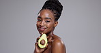 Beauty, avocado and face of black woman in studio for healthy cosmetics, nutrition and detox on grey background. Portrait, happy model or fruit for sustainable benefits, eco friendly skincare or diet