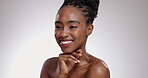 Woman, face and smile with beauty in studio for glowing skin, wellness and detox with chemical peel. African model, person and mockup for facial treatment, body care or skincare with white background