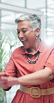 Mature, woman and happy dance in office for celebration of promotion, success or excited for bonus. Business, winner and person cheering with energy from achievement of target or goals on project