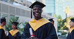 Black man, graduation and certificate of university student in education or learning at outdoor campus. Portrait of African male person or graduate smile with qualification, degree or diploma in city