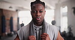 Gym, fitness and face of black man with workout, exercise and ready for challenge, boxing or training. Portrait of a young active person or boxer with towel, tired and breathing for endurance workout