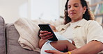 Mother, texting and freelancer networking with baby, communication and childcare at home. Mommy, multitasking and mobile app for email on technology, conversation and comforting child in living room