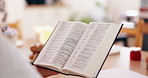 Person, bible book and closeup with hands, reading or studying for praise, worship or faith in home. Knowledge, information or religion with history, learning or spiritual guide for connection to God