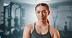 Gym, serious and face of woman confident in fitness, bodybuilding or exercise for sports development. Dedication, portrait and bodybuilder ready for athlete workout, training or challenge performance