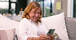 Home, smile and senior woman with a smartphone, typing and connection with social media, texting or chatting. Pensioner on a sofa, apartment or old person with a cellphone, meme or email with contact