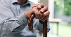 Hands, senior man and walking stick in closeup for recovery, balance and rehabilitation in nursing home. Retirement, wood cane and mobility aid for steps, movement and person with disability in house