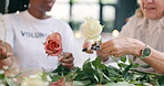 Women, flower arranging and old age retirement for fun activity as helper, support or service. Black person, elderly and rose steams or leaves organise for together connection, bouquet or volunteer