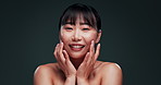 Korean, face and skincare of woman with beauty in studio with confidence and pride from dermatology. Happy, girl and smile for healthy glow on natural skin from facial or cosmetics in dark background