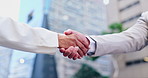 Handshake, partnership and business people in city, agreement and collaboration with support and trust. Meeting, introduction and team for corporate deal, networking and shaking hands outdoor