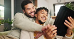 Gay couple, home and tablet with love, funny and communication in living room and bonding together. Apartment, lgbtq and men with technology, typing and digital app with queer people, smile or relax