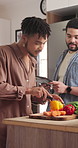 Home, cooking and gay couple with tablet, conversation and vegetables with ingredients and food blog. Queers people, kitchen or men with technology, online recipe or hobby on the weekend break or app