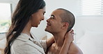 Couple, hug in bed and smile for love and commitment, talking and forehead touch, romance and chemistry. People in relationship, bonding and care at home, communication or trust with peace and calm