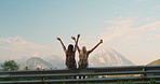 Happy women looking at view. Two friends celebrating on holiday