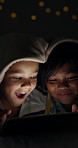 Smile, siblings and children on tablet in home at night, learning or conversation of family bonding together. Excited kid, brother and sister on tech for cartoon, surprise or playing game on bokeh