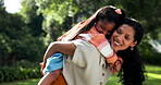 Mother, child and piggyback in park for games, fun in the sun and excited with bonding, love and care. Mexican mom, family or parent playing with girl or kid in nature, garden and outdoor for holiday