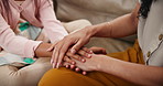 Mother, child and hands in care, support or trust for love, concern or confession on living room sofa at home. Closeup of mom touching daughter, kid or little girl for comfort or empathy at house