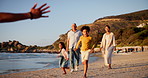 Family, grandparents and children running on beach with hug, love and hello to father and father for holiday. Excited interracial kids for energy, happy travel or walking by ocean or sea for vacation